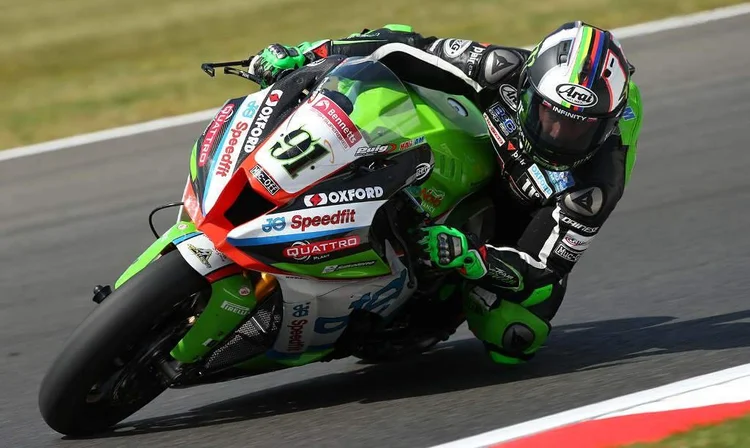 Superbike rider cornering at speed on track