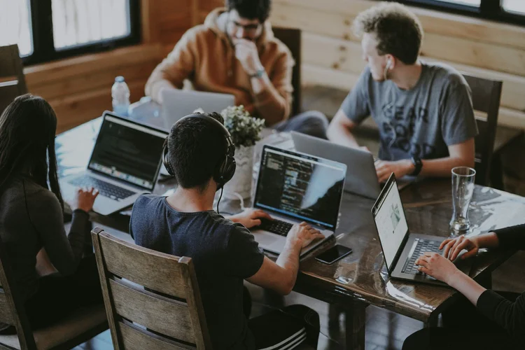 Development team working across laptops